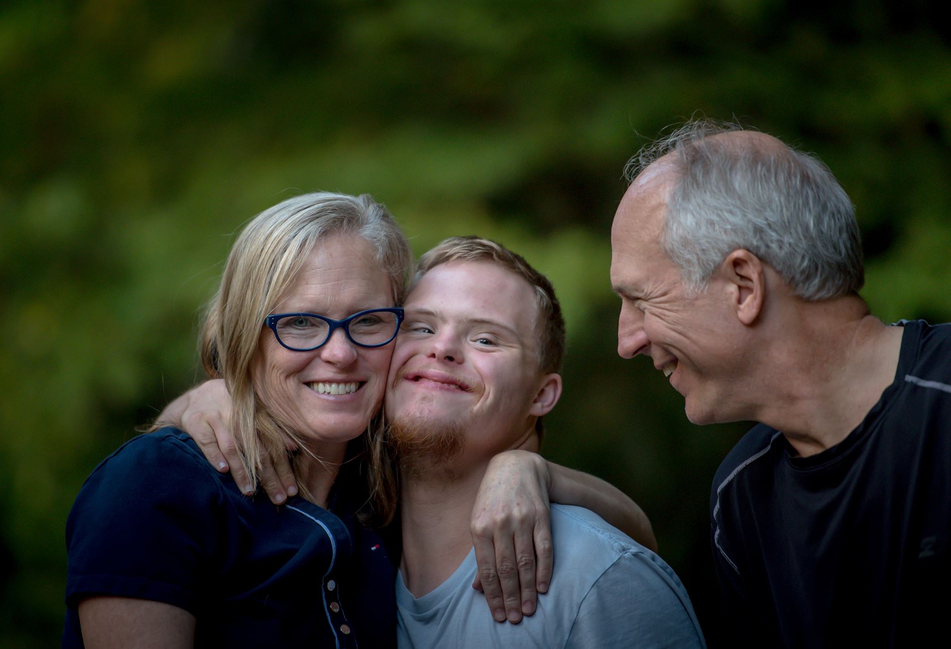 Downs syndrome man and family